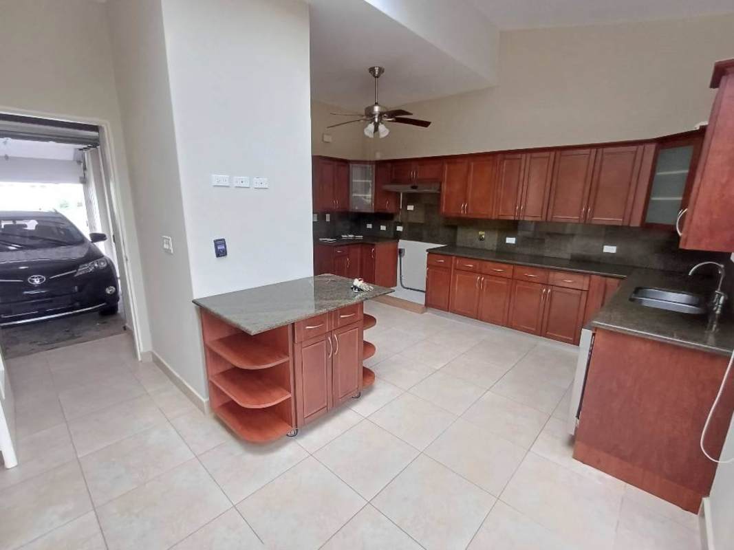 Bright living room with floor tiles, ceiling fan, terrace access Embassy Gardens Clayton