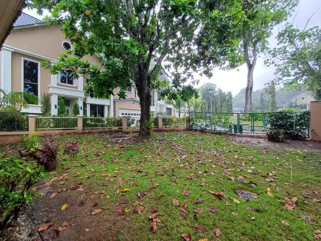 Kitchen with granite countertops and island, wood cabinetry in Embassy Gardens Clayton Panama