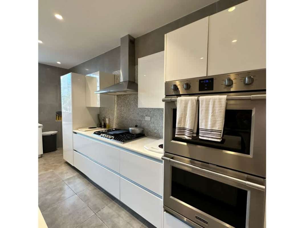 Modern luxury bathroom with double vanity and walk-in glass shower PH The Residences Punta Pacífica Panama