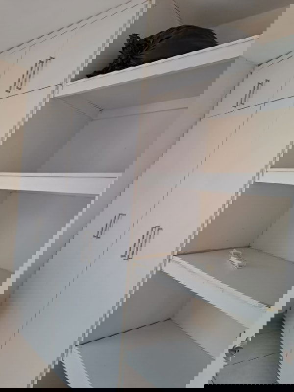 Bathroom with walk-in shower and pedestal sink in Parque Lefevre apartment Panama