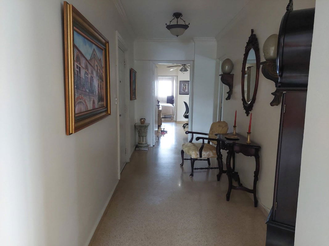 Dining area with city view windows and glass table in PH Santa Cecilia Obarrio Panama City
