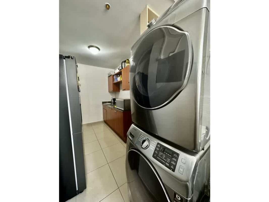 Apartment complex exterior with swimming pools and tennis courts in PH San Francisco Bay Panama City