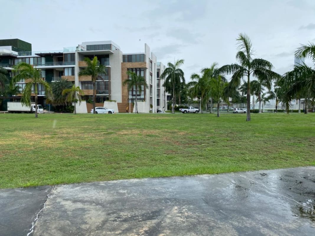 Modern condo buildings with palm trees and landscaped parks Ocean Reef Islands Panama City