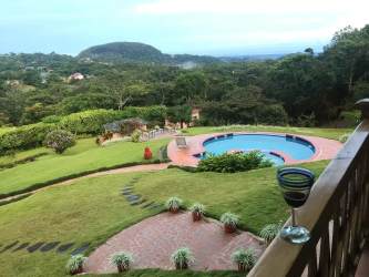 Lush landscaped grounds with swimming pool and garden views in Los Llanitos El Valle Panama