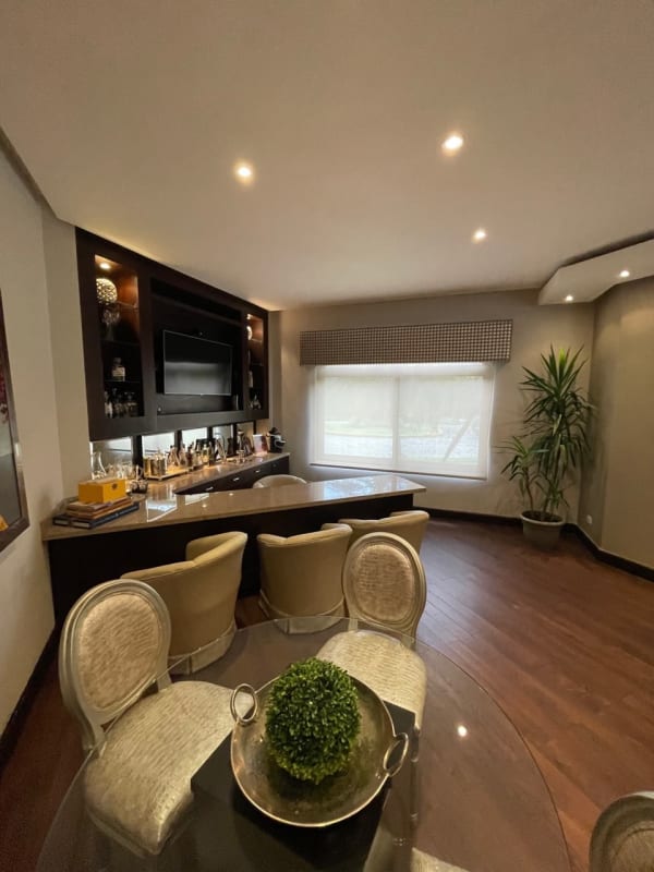 Modern private pool with sun deck surrounded by tropical garden in luxury Panama residence