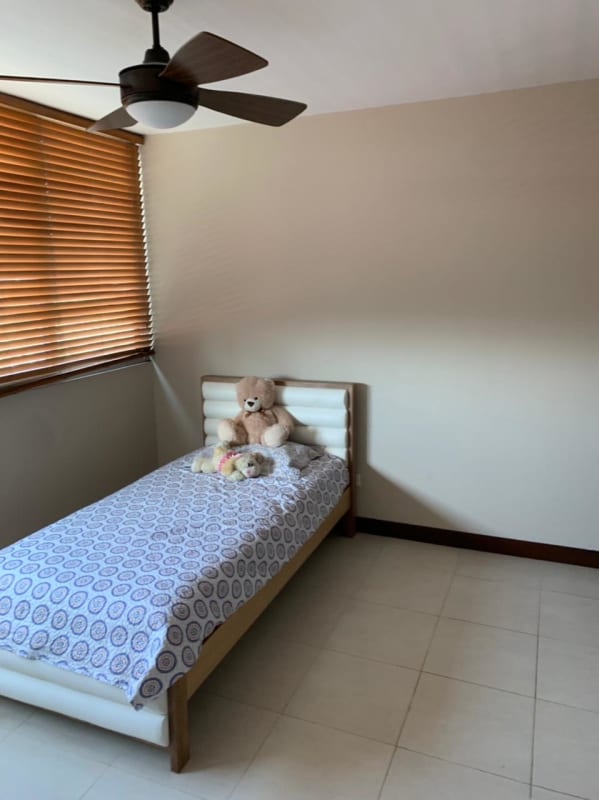 Bedroom with large window overlooking Costa del Este park PH Tower Panama City