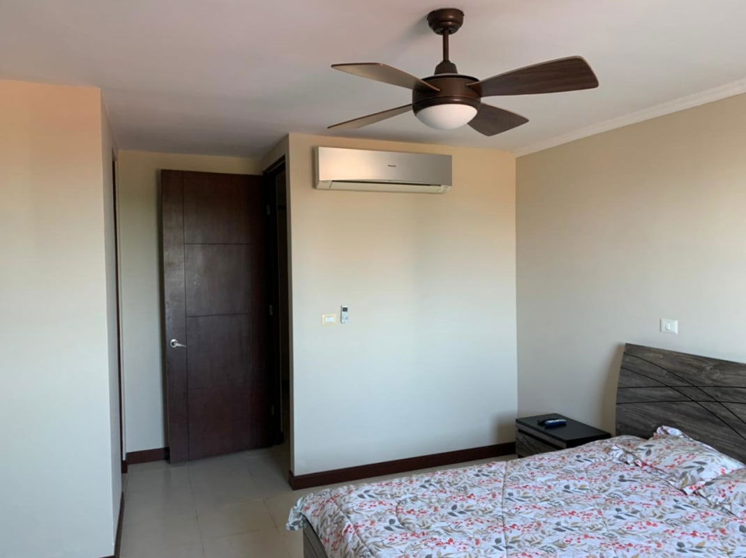 Modern bedroom with AC unit and closet at Costa del Este Panama