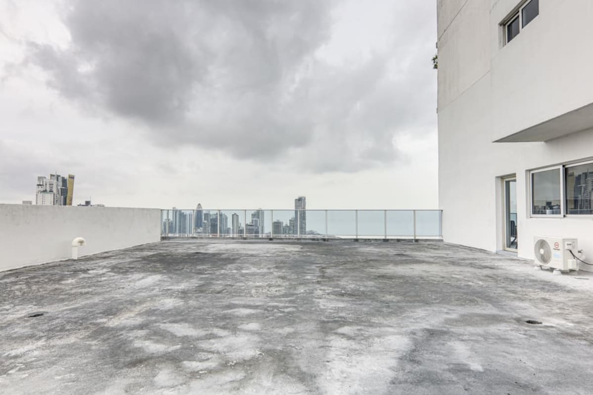 Kitchen with stainless appliances, granite counters in penthouse White Tower on Avenida Balboa