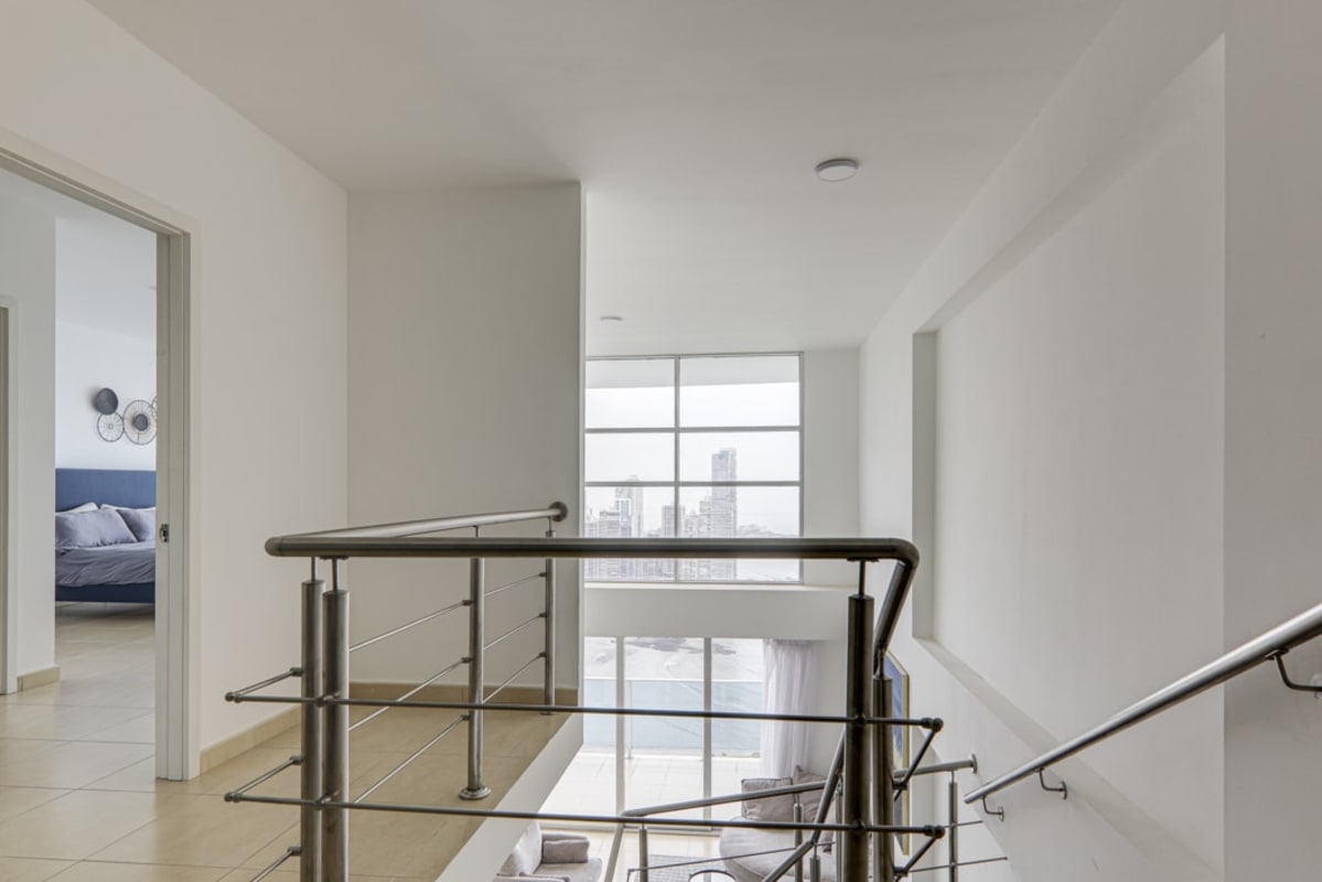 Spacious master suite with floor to ceiling windows ocean view PH White Tower Panama City