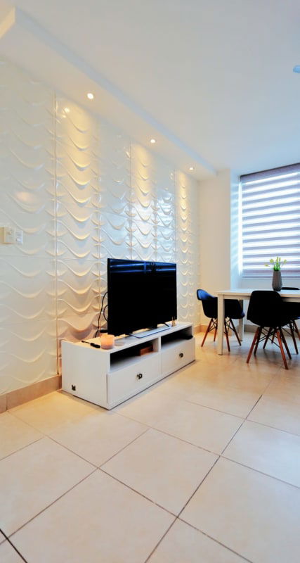 Fully furnished modern living room with accent wall at Vivendi Towers Tower 400 Edison Park Panama