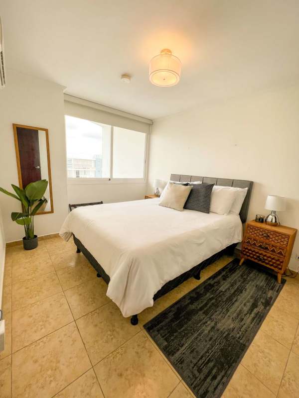 Spacious bedroom with closet and window city view PH Cosmopolitan Panama