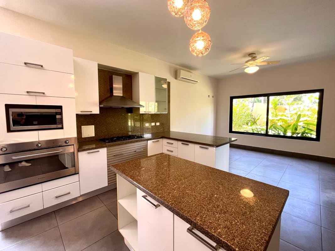 Family room open space marble floors overlooking terrace Costa del Este house Panama