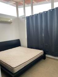 Minimalist bedroom with large window, air conditioning, tile floors in Coronado beach home