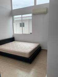 Fully equipped kitchen with granite counters and wooden cabinets in beach house Coronado Panama