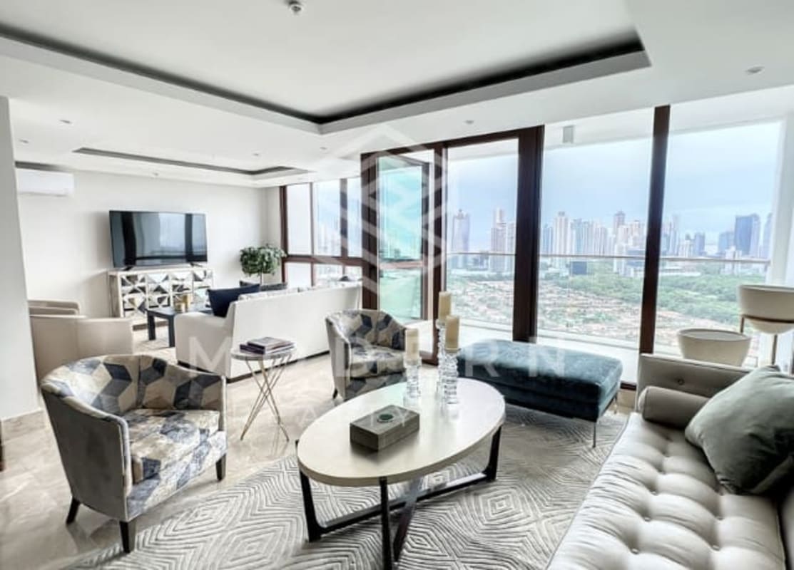 Modern living and dining area with large windows and skyline view Santa Maria Golf