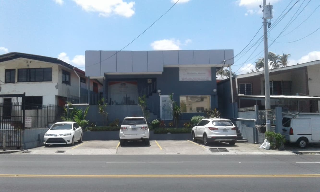 Retail storefront units with glass windows and signage in commercial building Panama