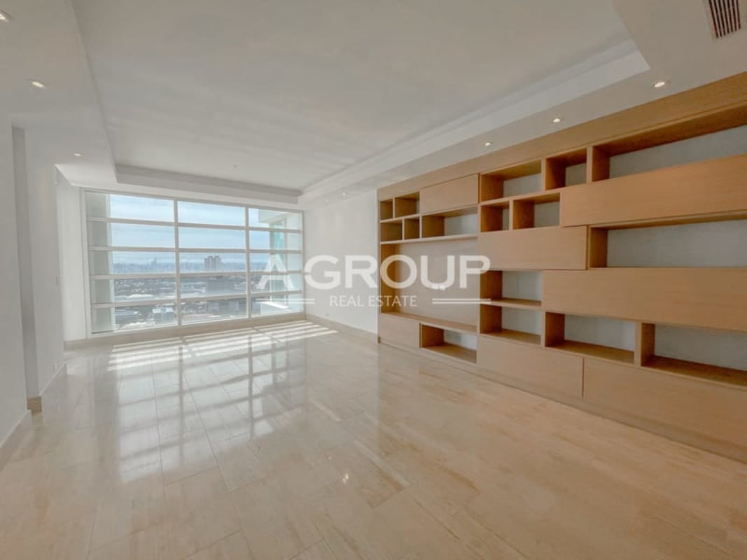 Bright living and dining area with floor-to-ceiling windows ocean views PH Aria Costa del Este Panama