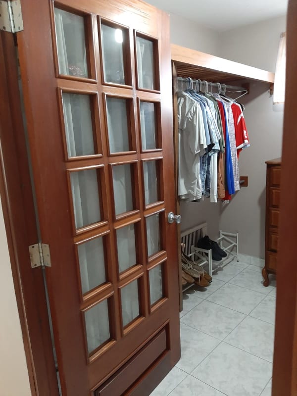 Spacious living and dining room with tile floors large windows Villa de las Fuentes