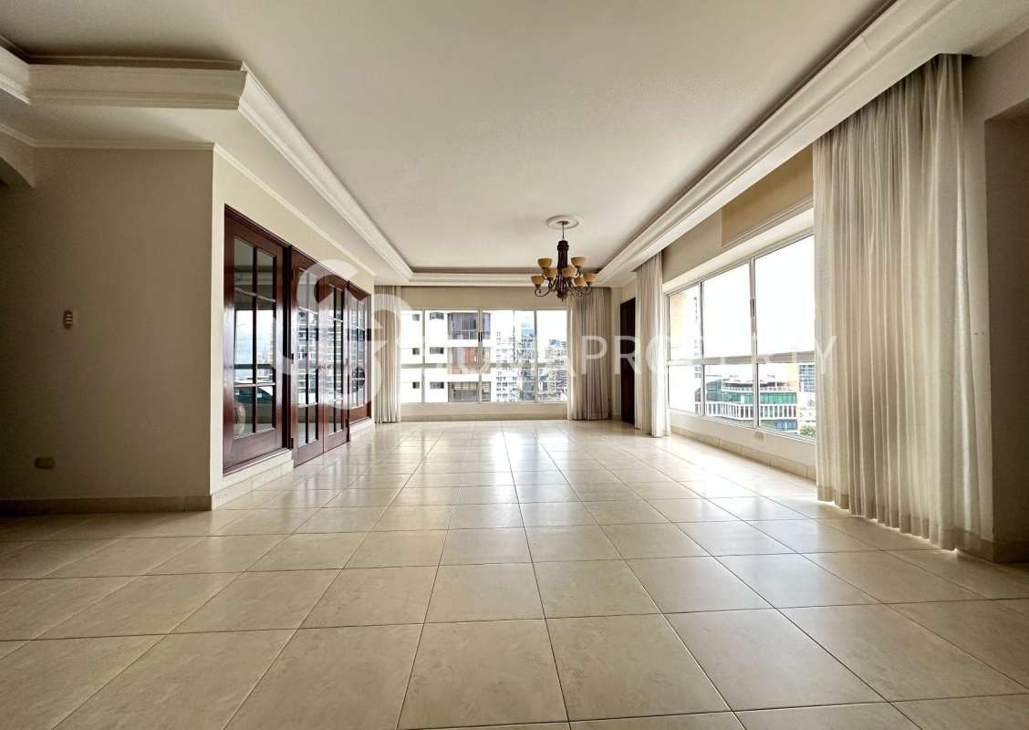 Spacious living area with panoramic windows and city views at PH Victoria Tower Panama City