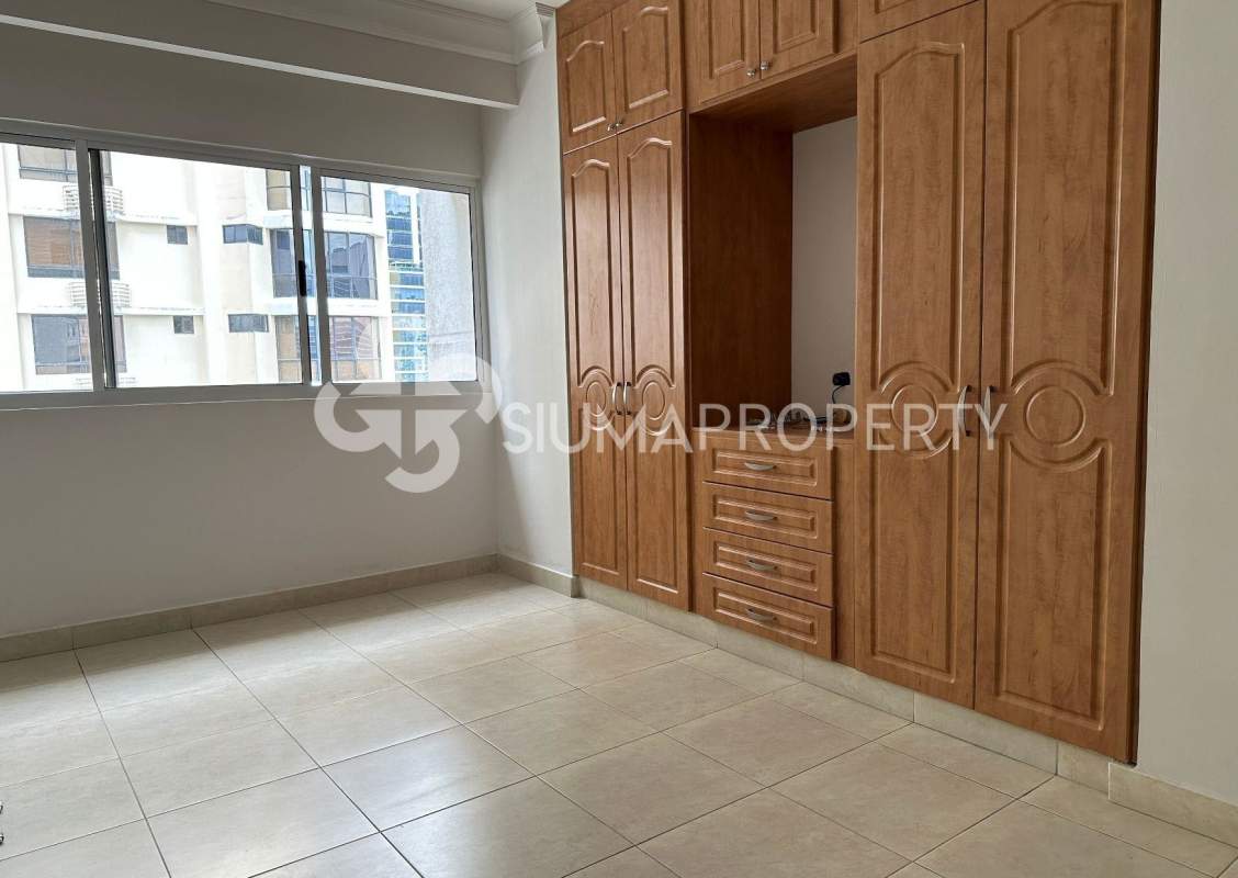Empty bedroom space with closet, window and city view in PH Victoria Tower Panama