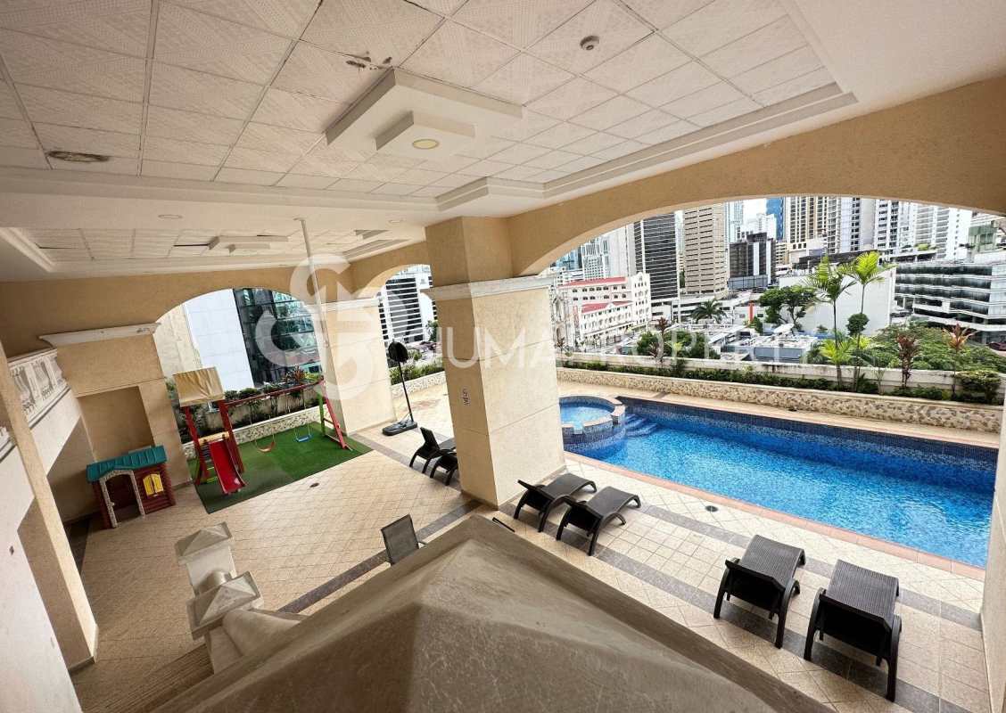 Outdoor children’s play zone next to pool at PH Victoria Tower in Obarrio