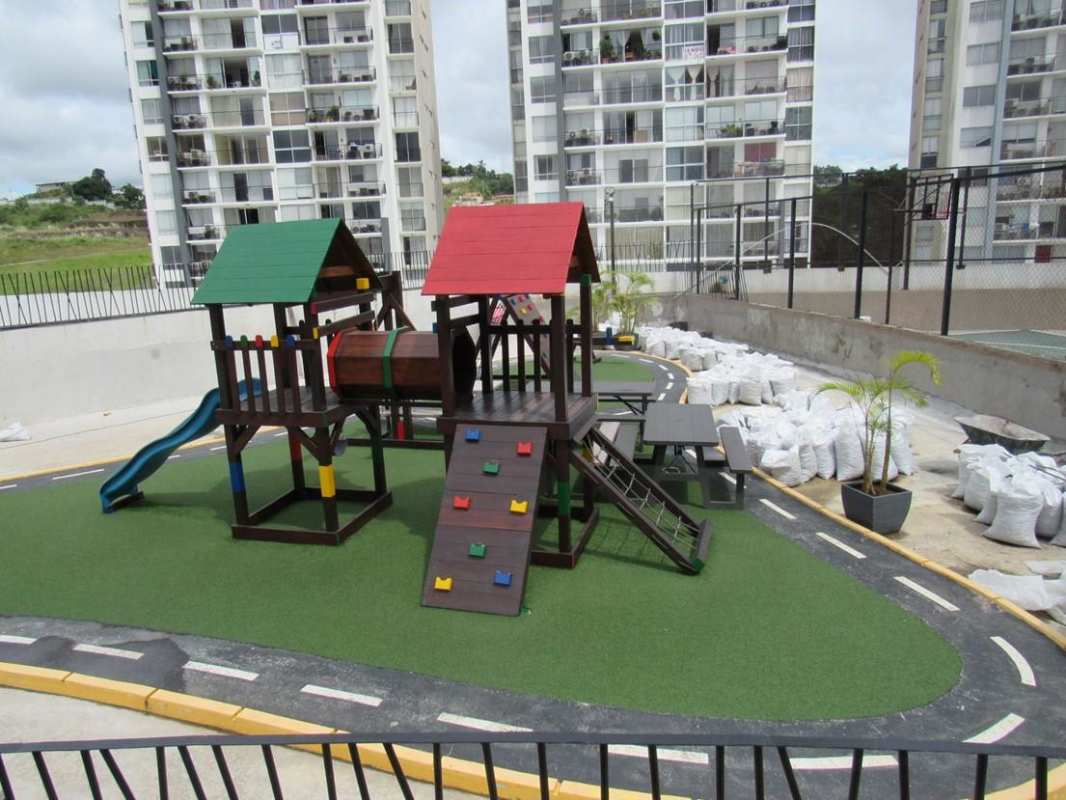 Children’s playground with slides and turf in PH Aviñón apartment complex El Bosque Panama