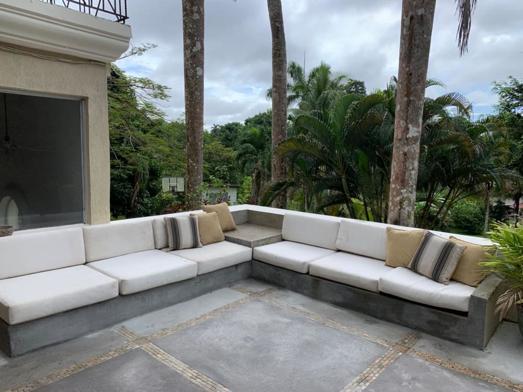 Luxury bathroom with large jacuzzi tub, marble counters, large windows overlooking gardens in exclusive Albrook home Panama