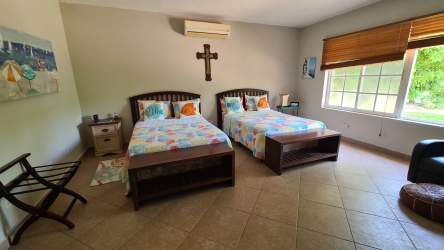 Exterior view of Mediterranean style villa with garden landscaping in Coronado Panama