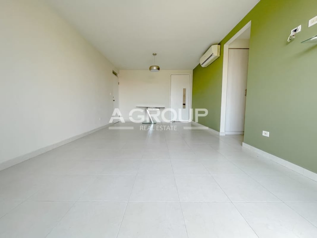 Living dining with green accent wall and tiled floors in Juan Diaz Panama