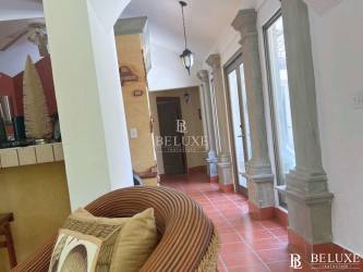 Open living dining area facing garden and pool in Buenaventura beach villa for sale