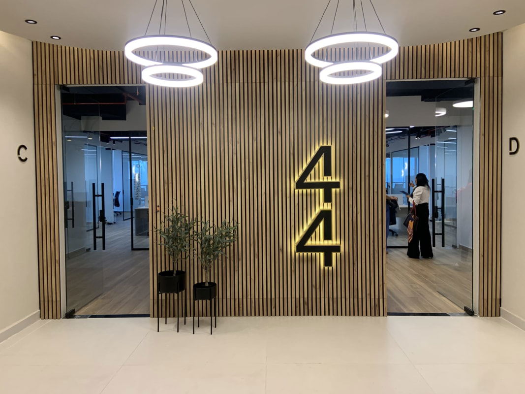 Private corner office featuring panoramic city skyline and partial sea view inside PH BICSA Tower