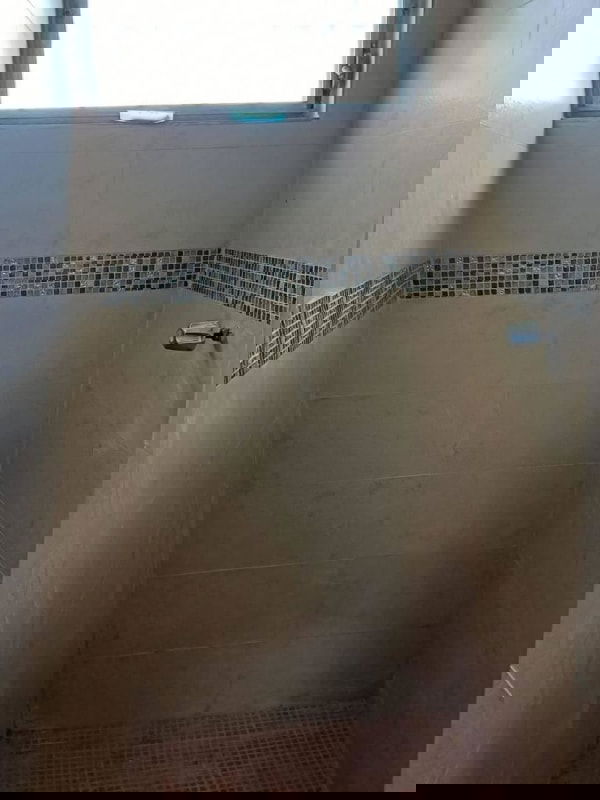 Bedroom with balcony door, curtains, tiled floor view in Las Cumbres Panama