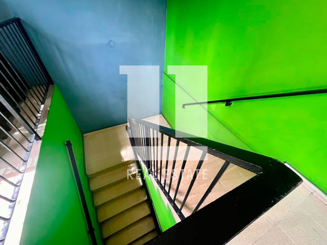 Internal stairway with painted walls metal rails in commercial house Marbella Panama City