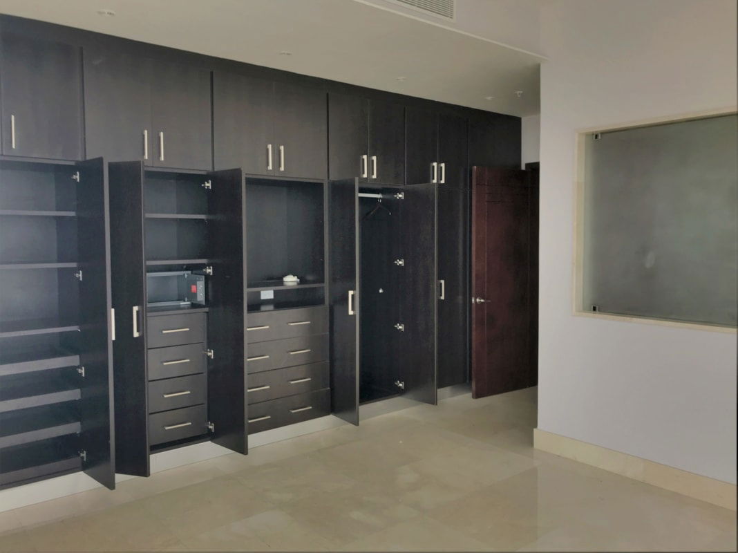 Elegant marble-floored living room with floor-to-ceiling windows 360 views The Point Panama