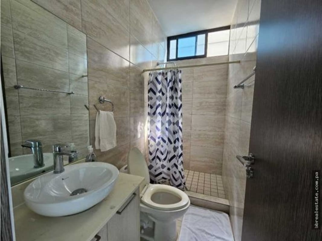 Covered pool with sundeck and panoramic city views in PH Canvas Tower Parque Lefevre Panama