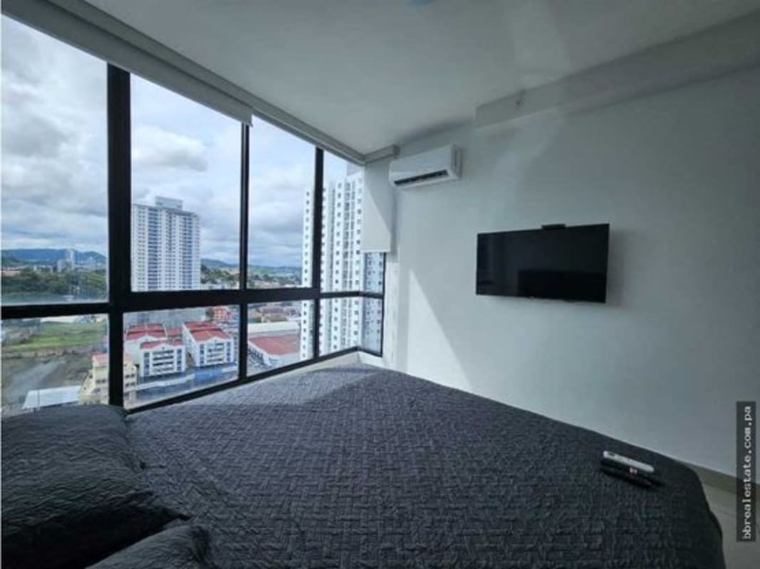 Private apartment balcony with glass railing and city skyline at Canvas Tower Panama