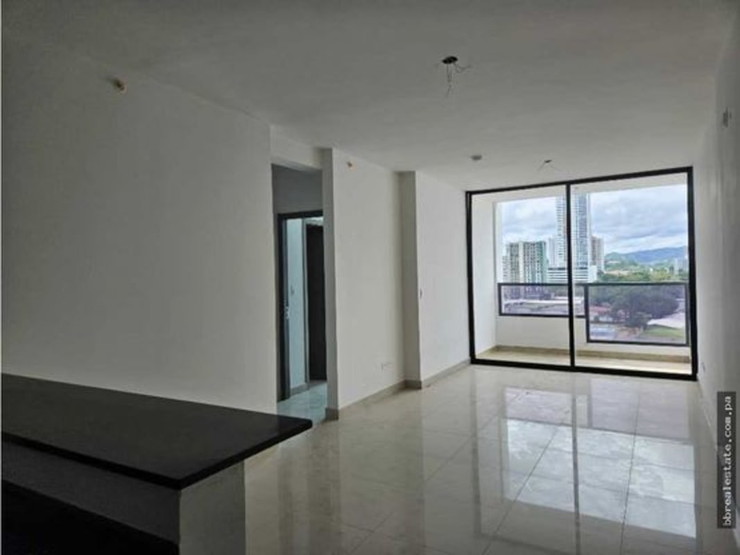 Spacious living room unfurnished with ceramic tiles and balcony at Canvas Tower Panama City