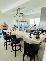 Kitchen with granite countertops, wood cabinets and appliances Bijao Beach Resort apartment Panama