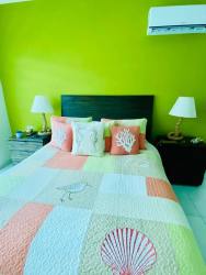 Master bedroom with ensuite bathroom, balcony access, ocean views at Bijao Quarry Heights Panama