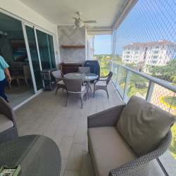 Bright open concept living dining room with ocean view at Quarry Heights Bijao Panama