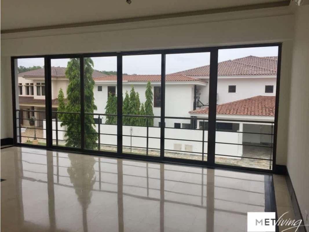 Walk-in closet with built-in shelving and ample hanging space in master suite Toscana villa Costa del Este