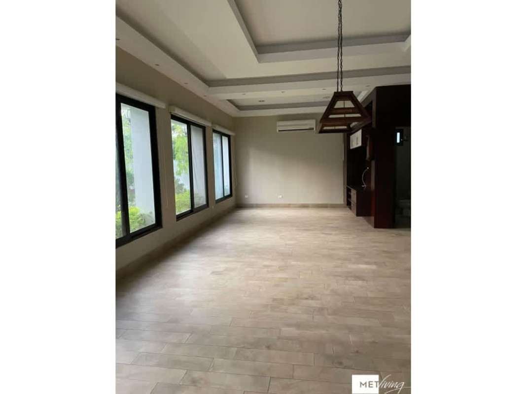 Luxury bathroom with marble finishes, double sink vanity and glass-enclosed shower in Toscana Costa del Este villa