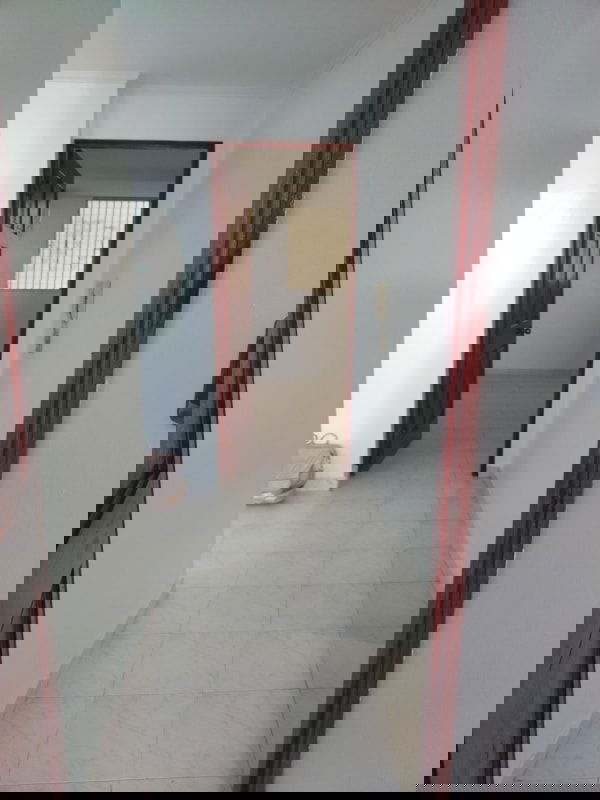 Hallway with natural light tiled floor wooden door PH La Cresta Panama