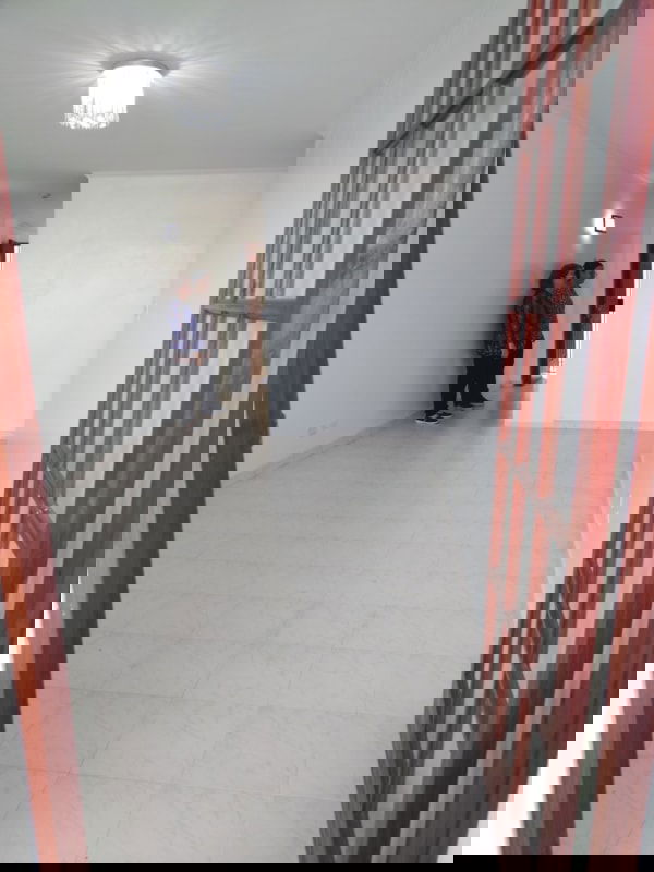 Living dining area white tiles chandelier glass doors PH La Cresta Residence