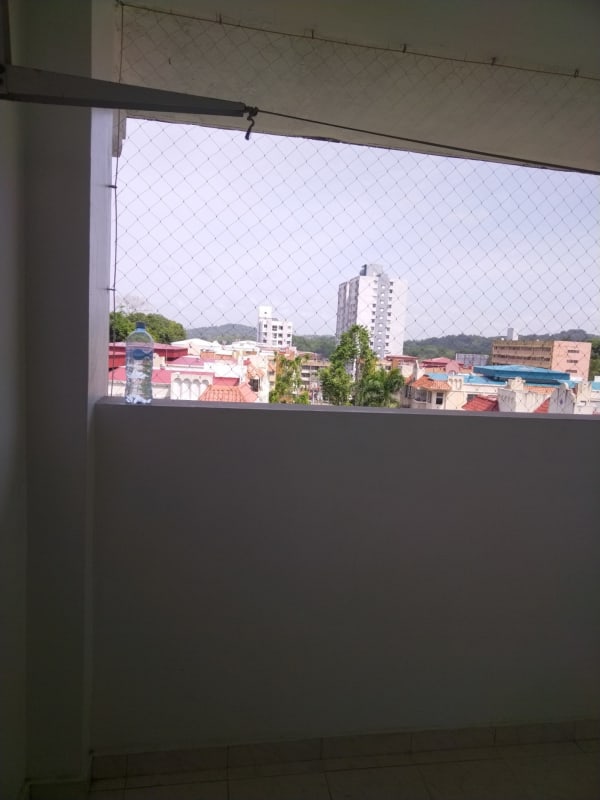 Balcony with netting overlooking Panama City skyline in PH La Cresta Residence