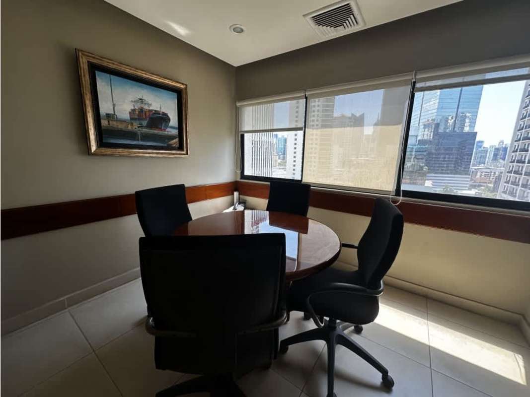 Office meeting room with round table, chairs, city skyline and large windows Scotia Plaza Panama