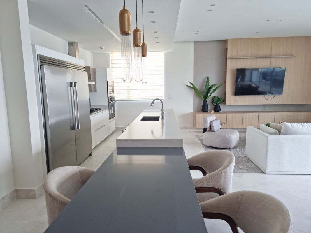 Fully equipped designer kitchen with island stainless appliances open dining Ocean Reef Islands Panama City