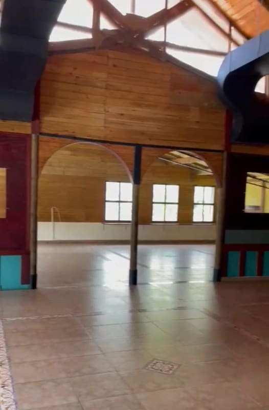 Wide interior hall with rustic wooden finishes in commercial space for rent Panama City