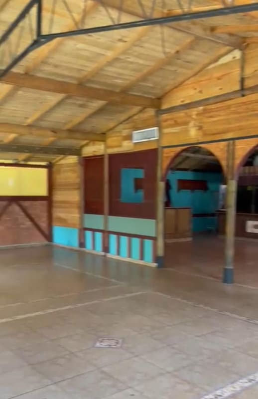 Interior commercial space arched doorways wood ceiling rustic design Panama City