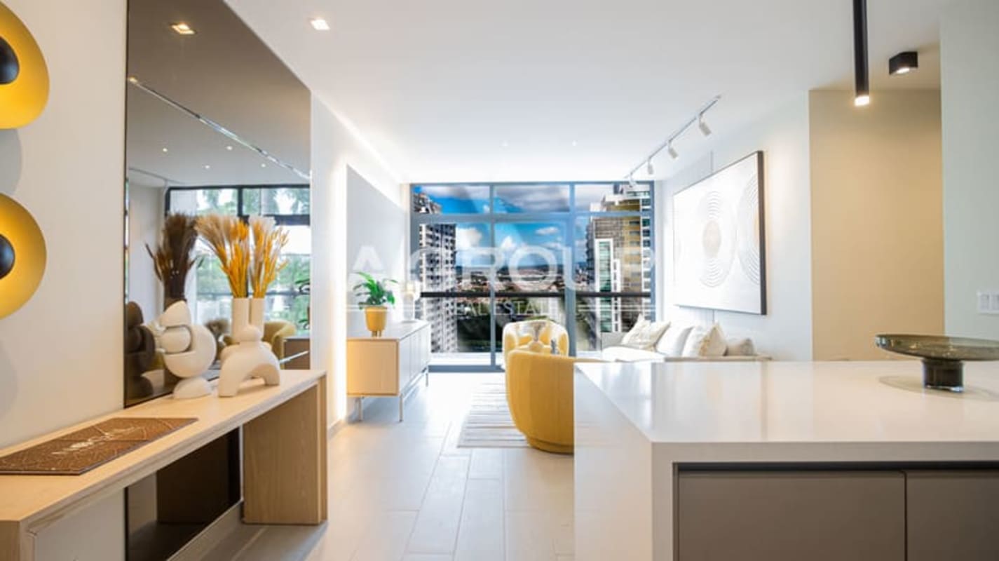 Private balcony with panoramic city skyline and ocean bay views at PH Nogal Costa del Este Panama